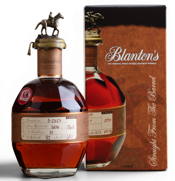 A bottle of Blanton's Straight From The Barrel single malt Scotch whisky with its brown cardboard box, featuring a horse-shaped metal cap, set against a plain white background.