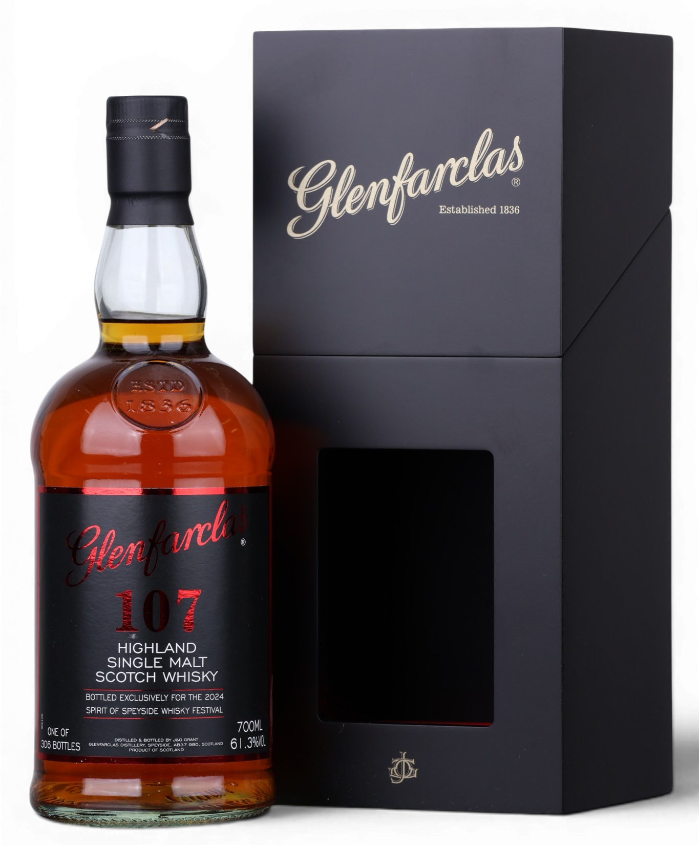 A bottle of Glenfarclas 107 Highland Single Malt Scotch Whisky next to its black presentation box with gold lettering, on a white background.