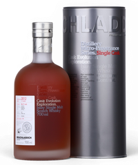 A bottle of Bruchlanich Cask Evolution Exploration 2012 single malt Scotch whisky next to its tall metallic silver cylindrical packaging tube, photographed on a clean white background.